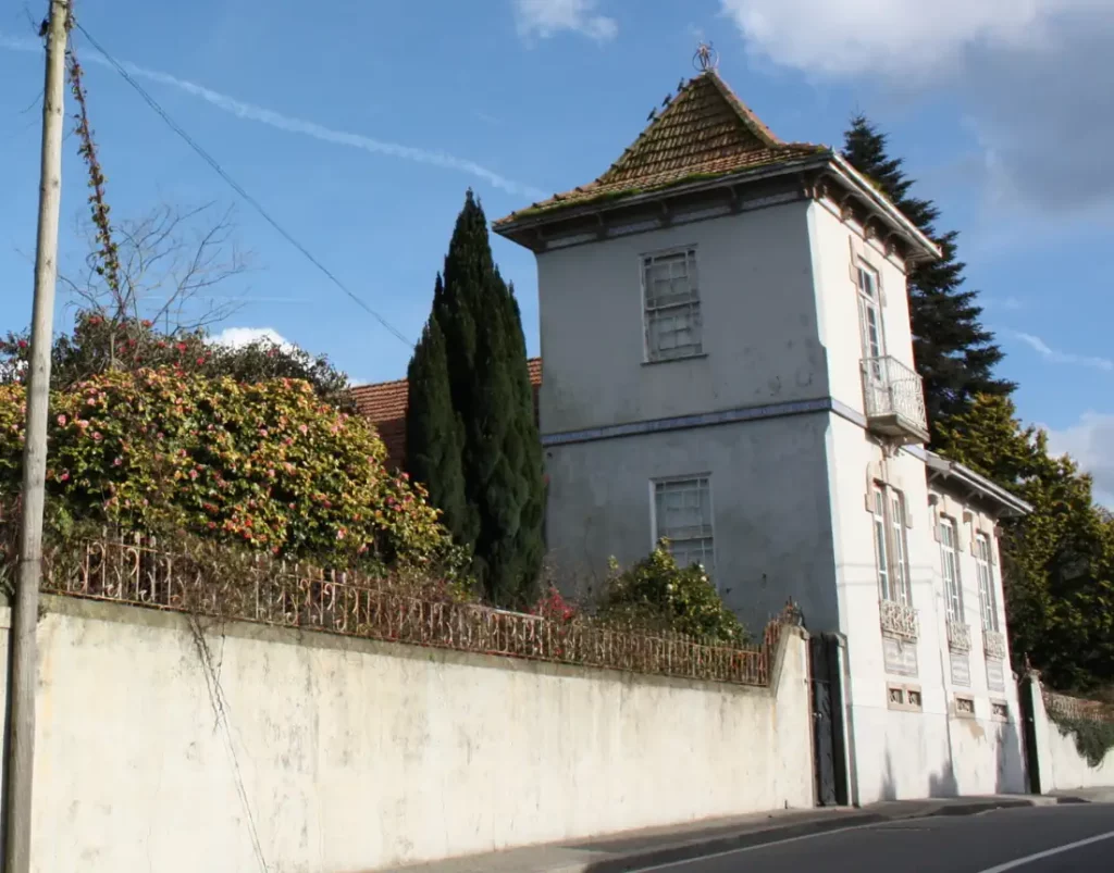 Street view showing the tower of the historic house