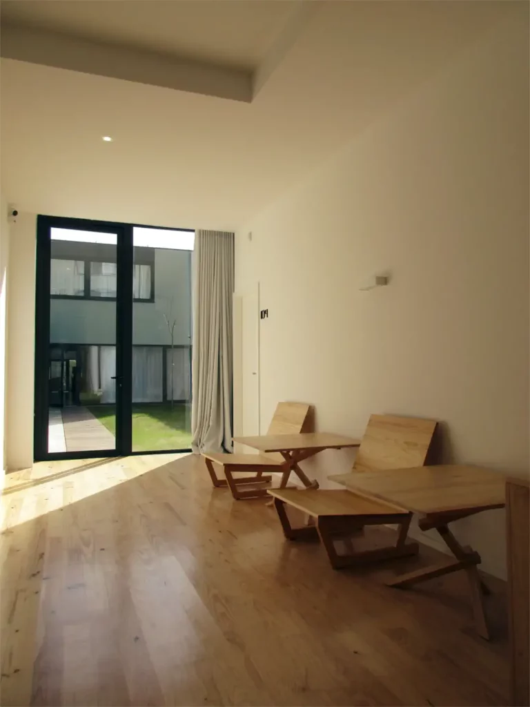 Hostel living room with wood furniture