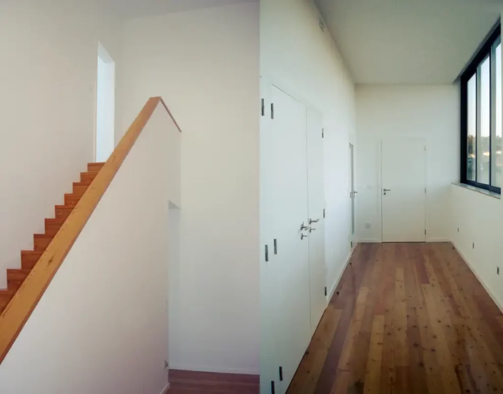 Mezzanine stairs and bedrooms hall of the restored house