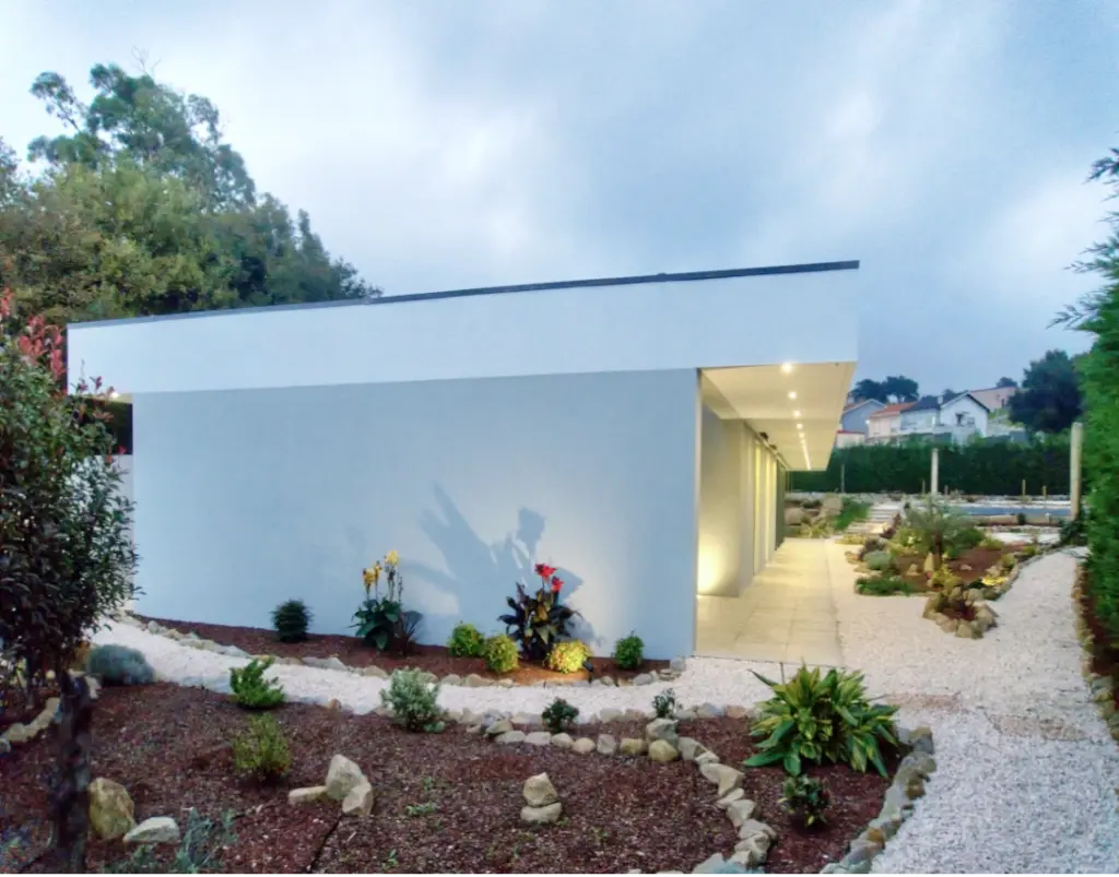 Garden with plants and rockery at the single storey house