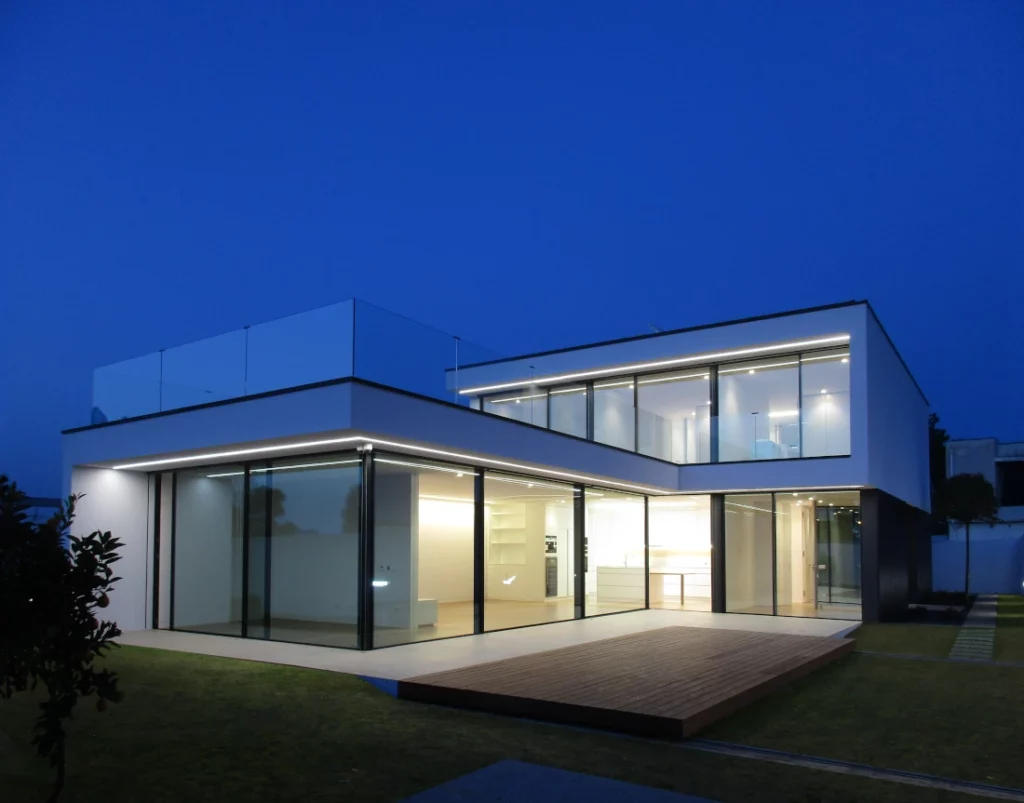 L-shaped house with covered pool and garden