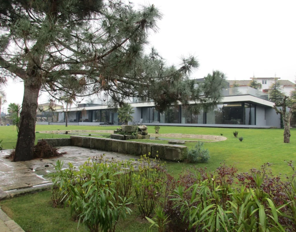 Garden tree with stone path near the luxury home