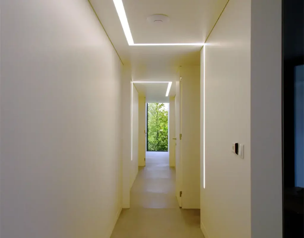 Corridor with modern light and a window at the end