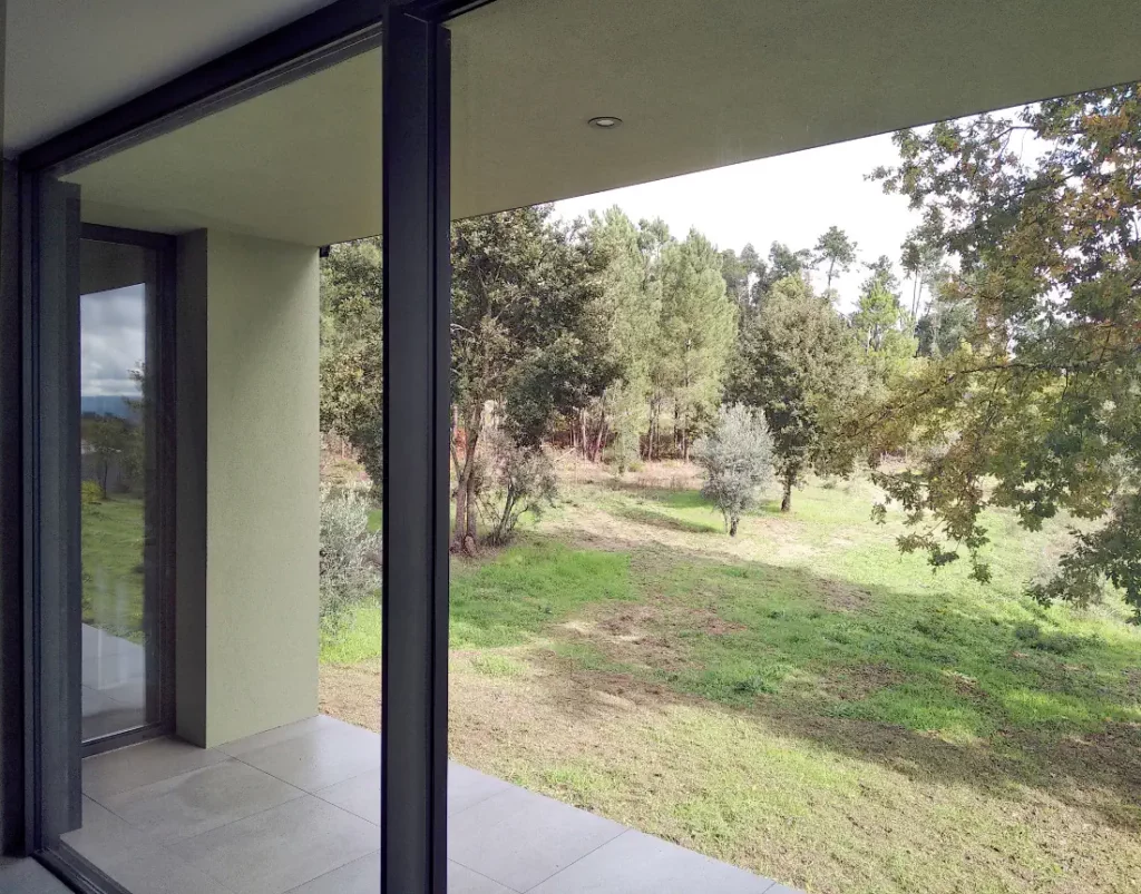 Bedroom porch with a green landscape