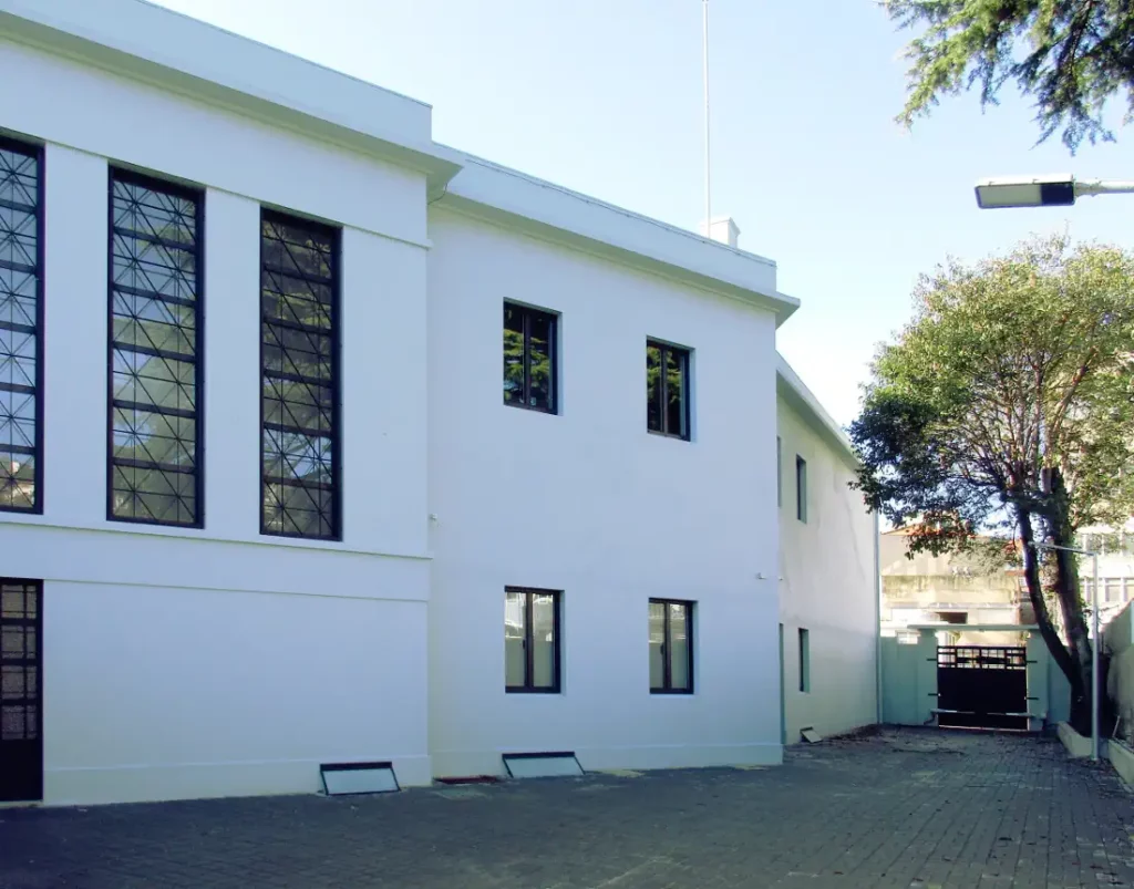 The backyard with parking and car entrance