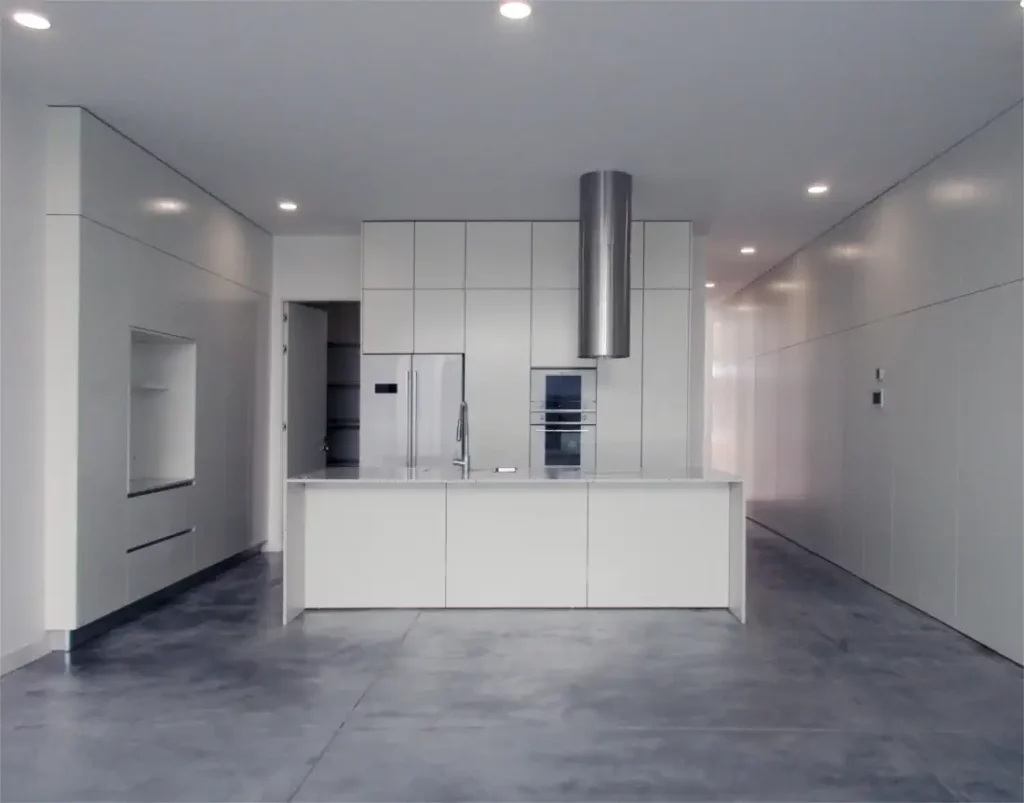 Open kitchen with isle and concrete pavement