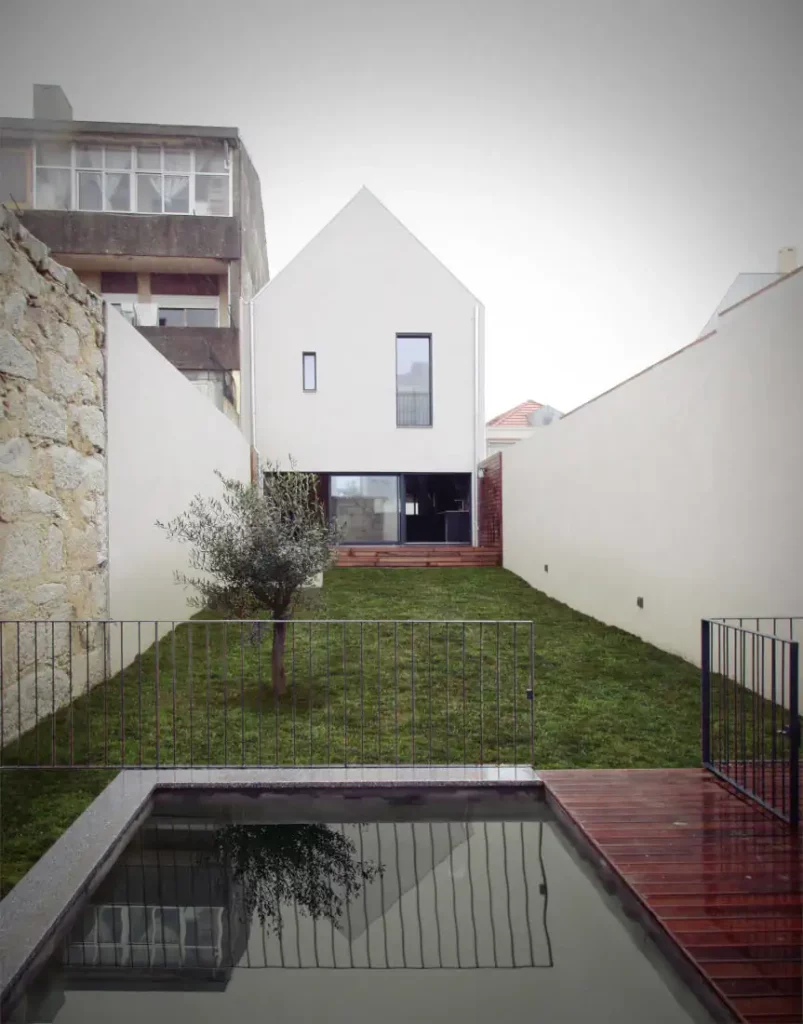 The swimming pool and back garden of the passive house